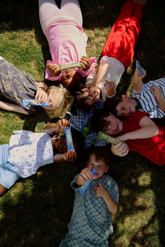 Kids in a circle with snacks