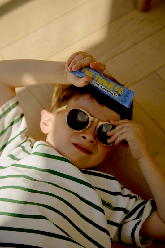 Kid after school holding a UPF free snack